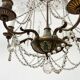 Louis XVI style chandelier with a pearl garland and painted tin, 20th century.