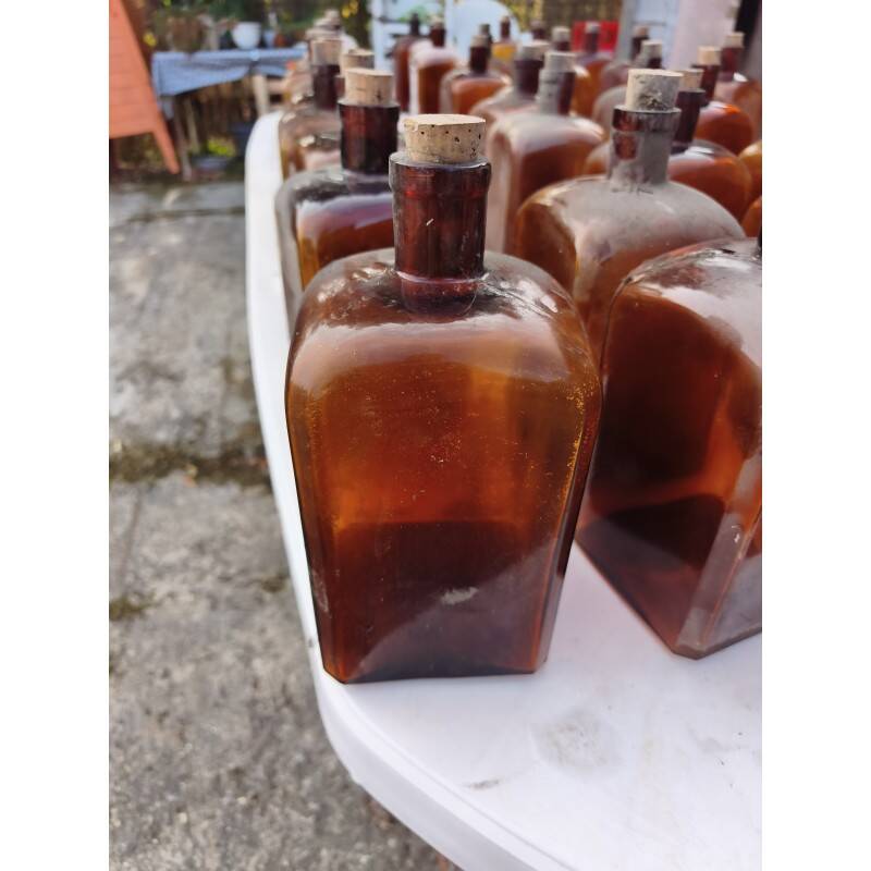 Set of 41 brown glass pharmacy bottles.