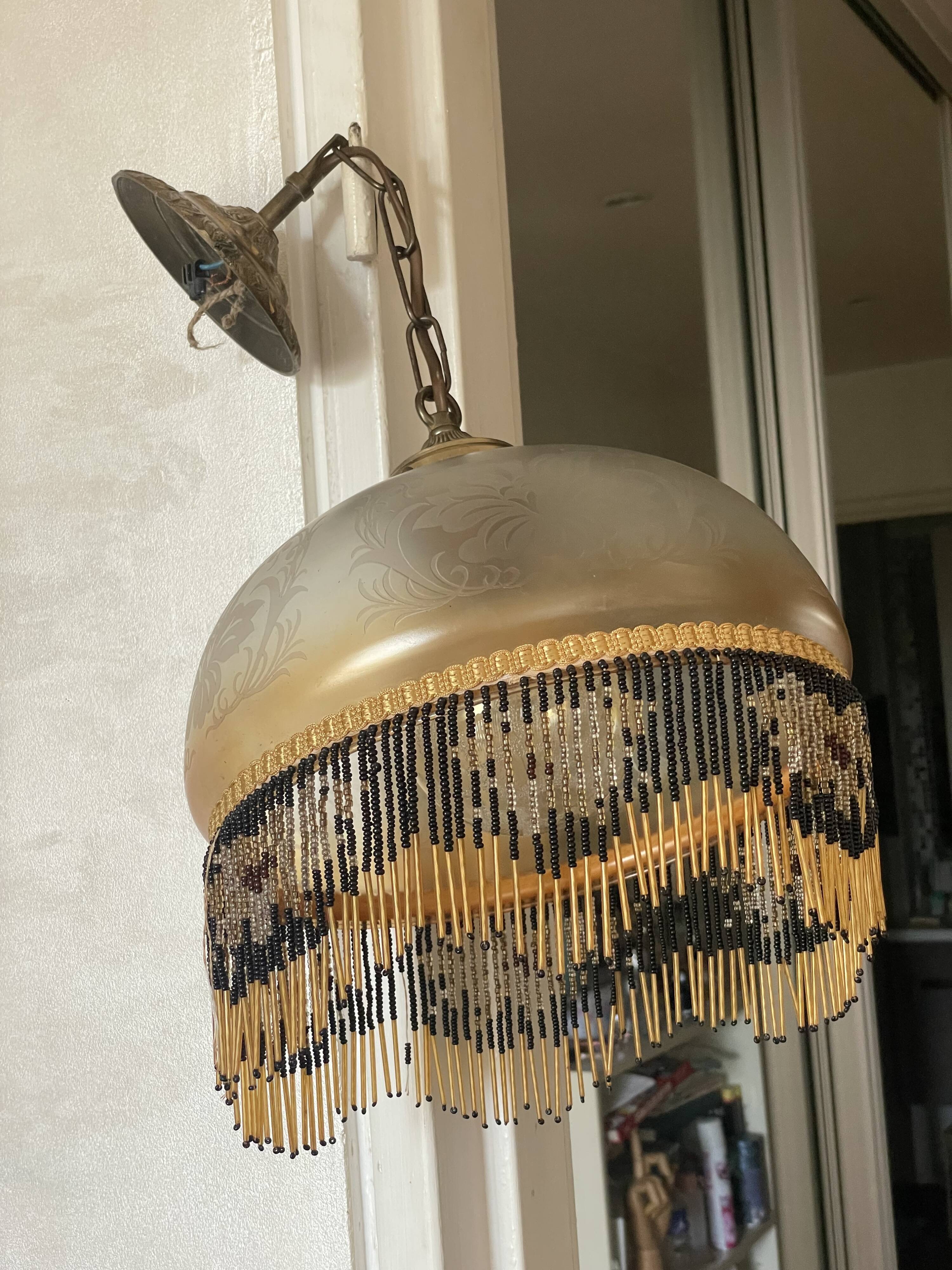 Glass lampshade and pearl tassels