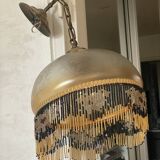 Glass lampshade and pearl tassels
