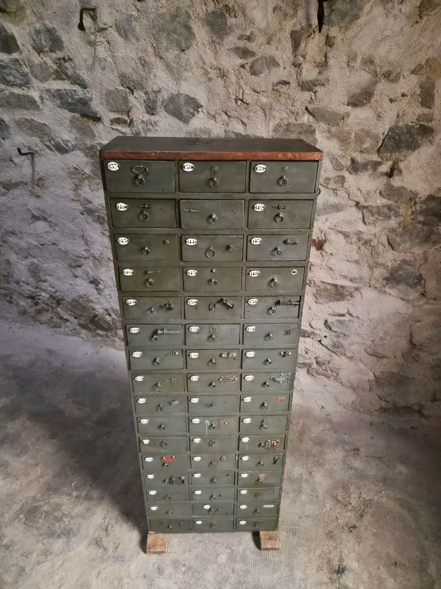 Antique hardware cabinet with 48 drawers, circa 1900.