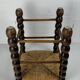 Brutalist wood turned bobbin rush stool in the style of Charles Dudouyt