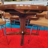 Baumann style round table with integrated extensions from the 70s