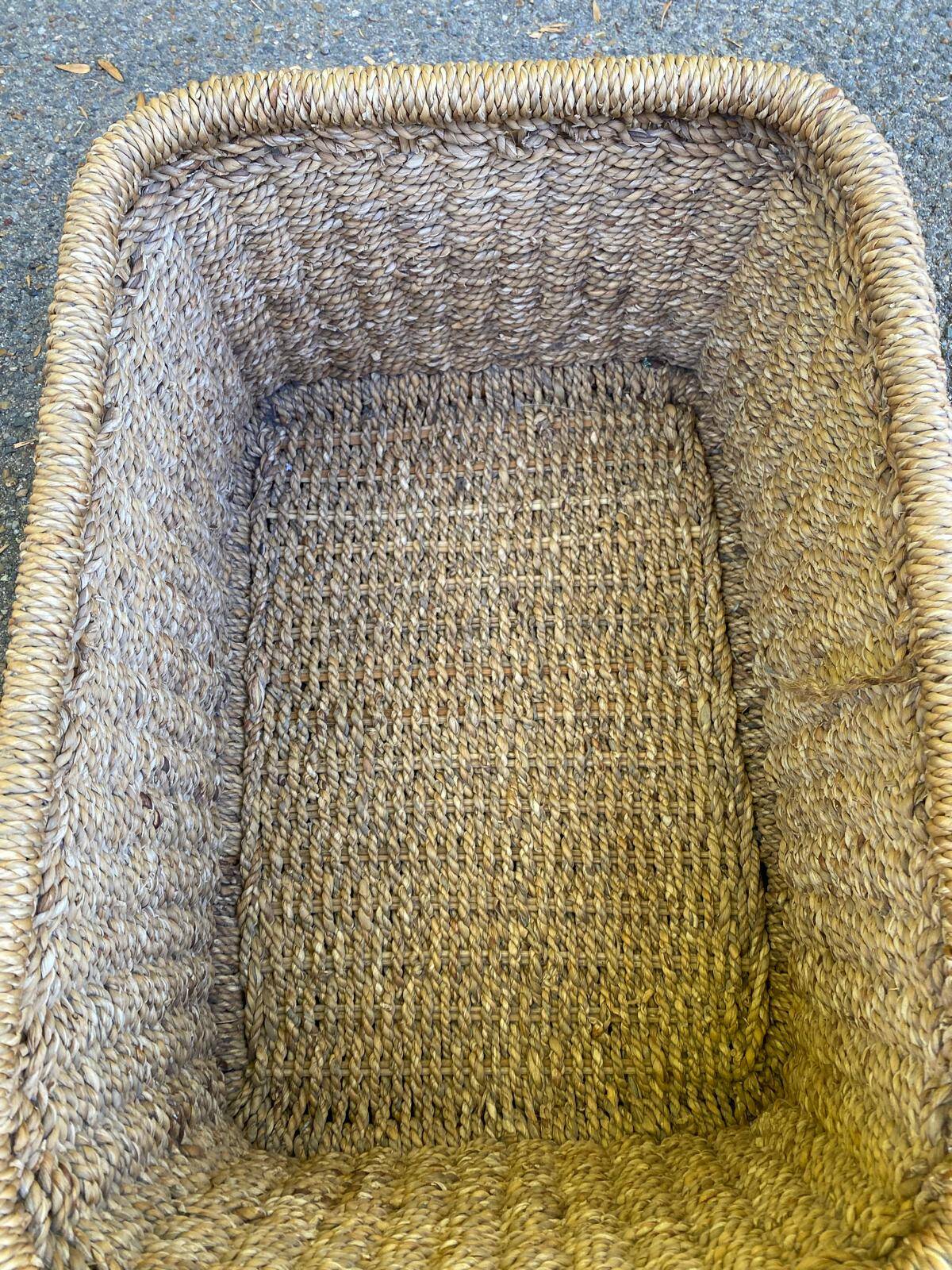 Large basket / rectangular storage bin made of woven natural fibre.