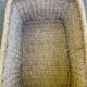 Large basket / rectangular storage bin made of woven natural fibre.