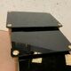 Pull out tables in brass and black glass XX century