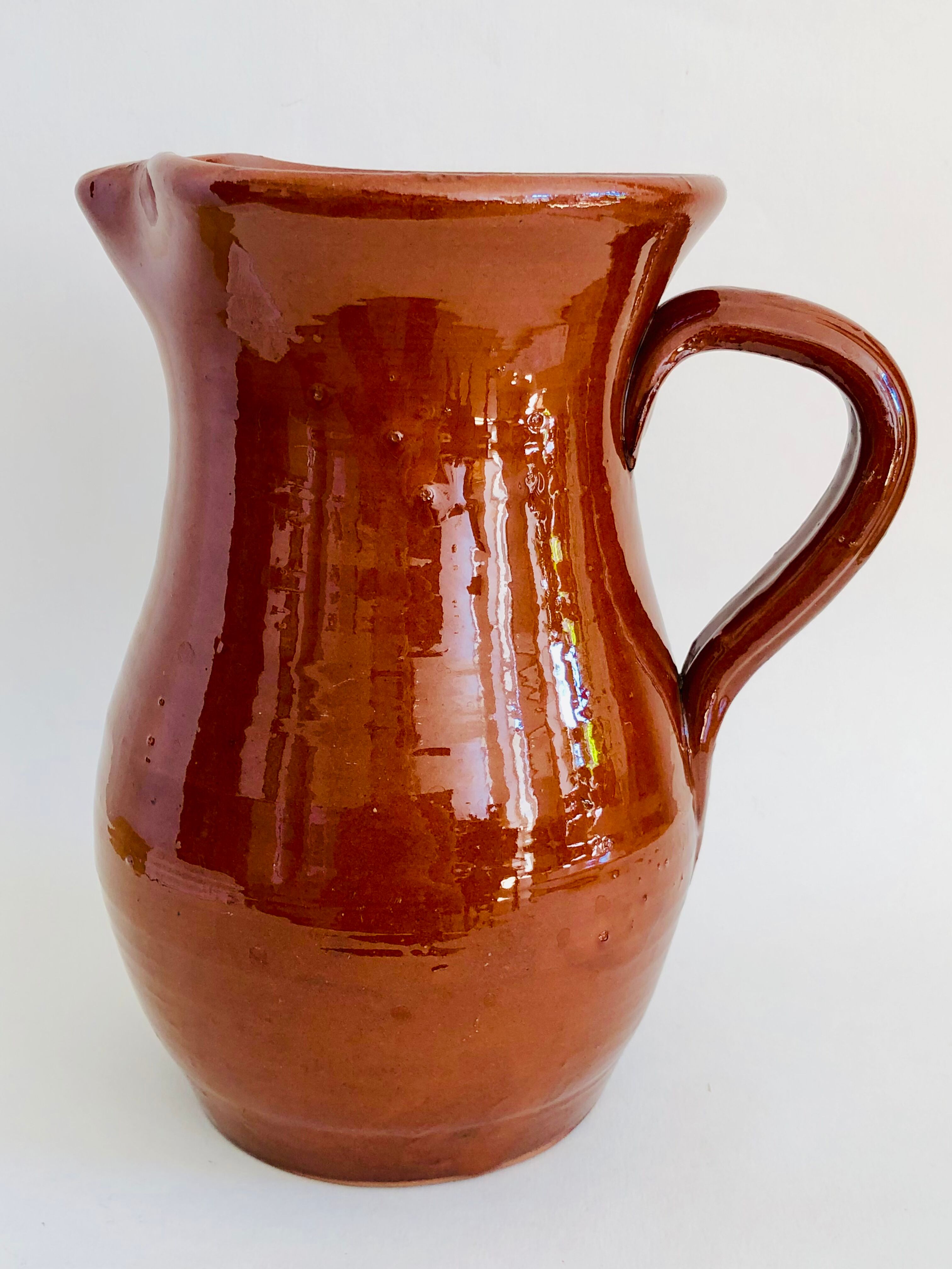 Vintage pitcher in glazed earth