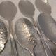 6 individual silver-plated metal sauce spoons with hammered baguette handles