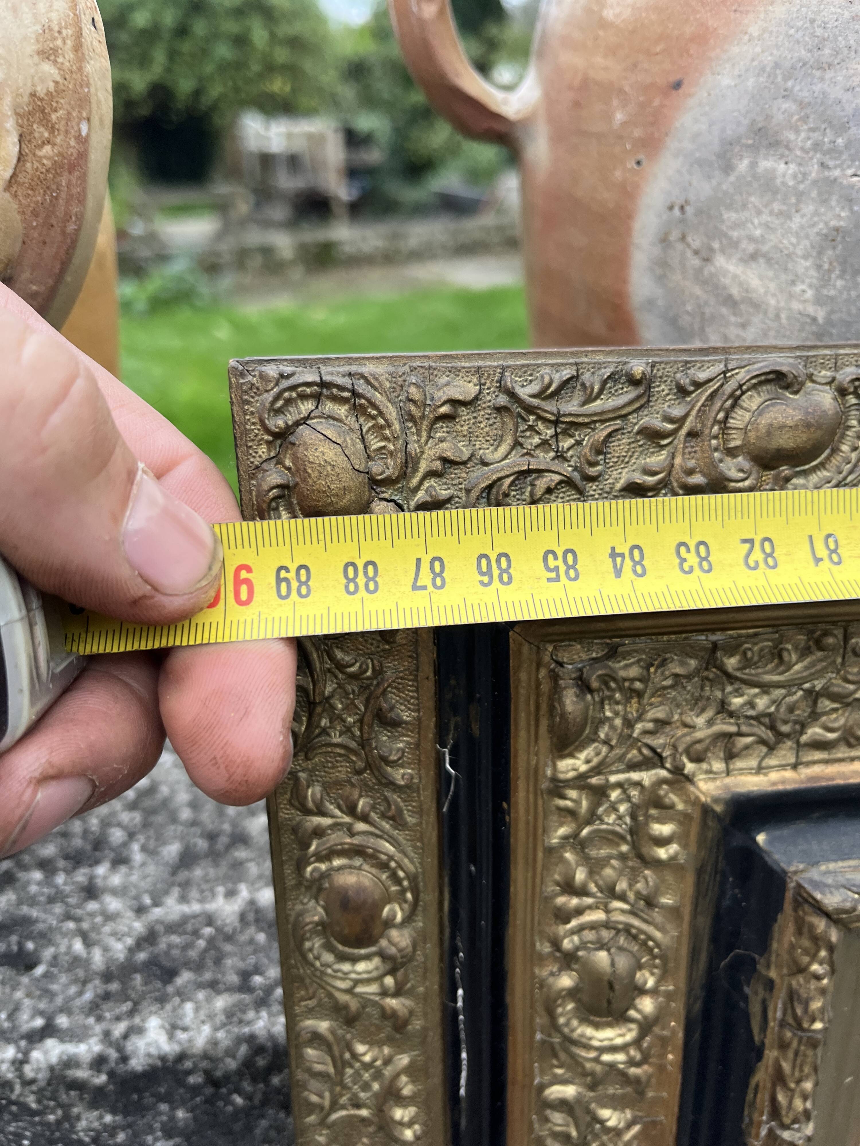 Large antique gilt mirror with scroll and shell decoration, 144 cm