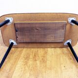 Low table with compass feet with decorative cabinet