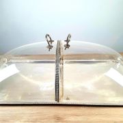 Large serving platter with lid, in silver metal.