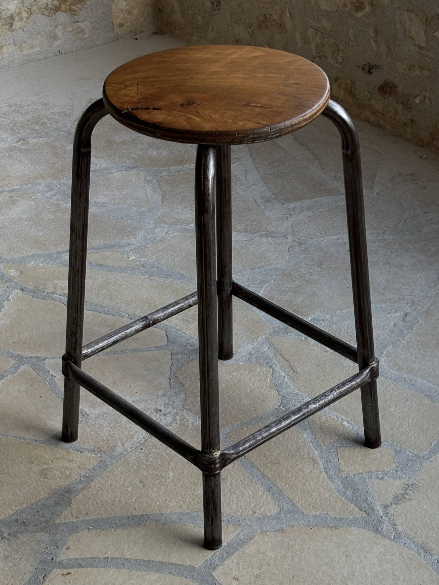 Old workshop stool in steel and beech