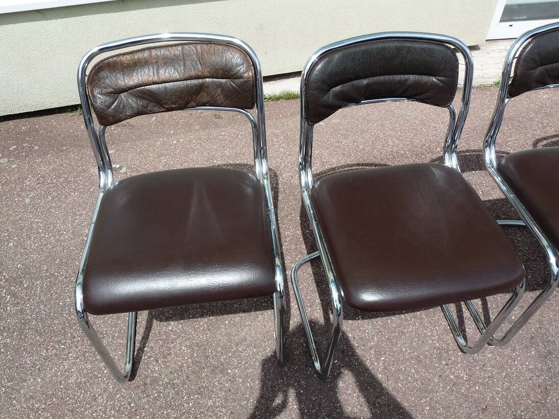 Set of 4 chrome metal and vintage leather chairs