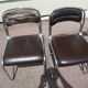 Set of 4 chrome metal and vintage leather chairs