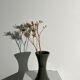 Dark green handcrafted vase with glazed ceramic grass blades