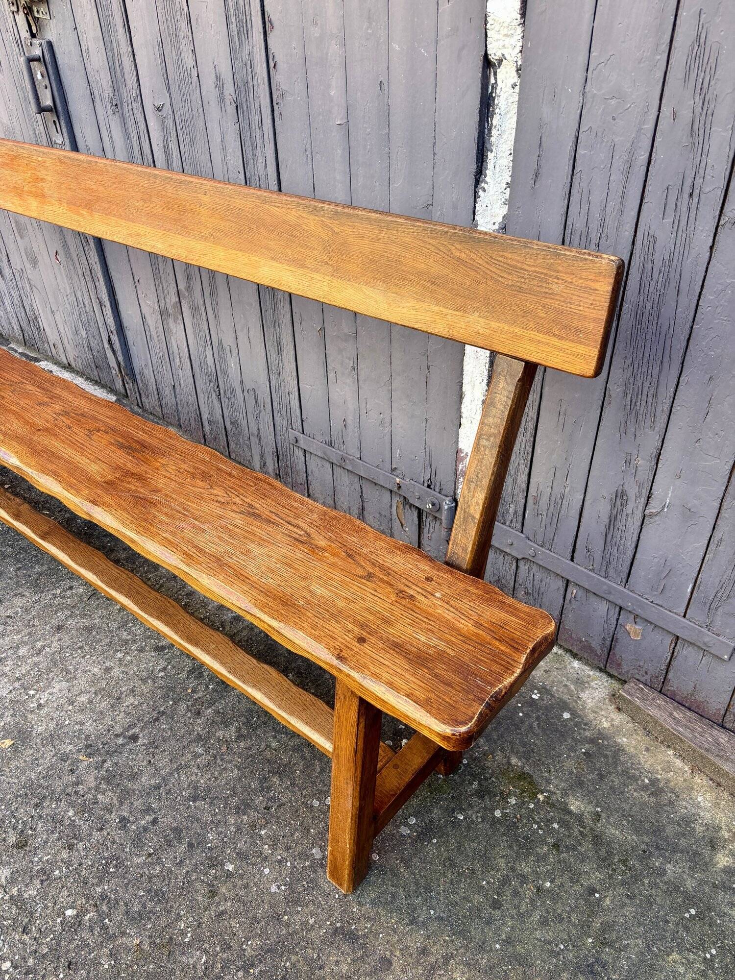Brutalist bench with dark wood back