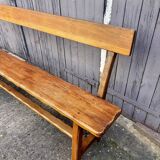 Brutalist bench with dark wood backrest