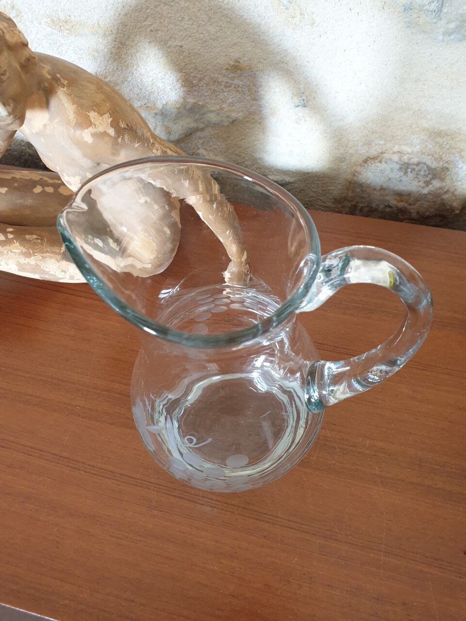 Pitcher decorating grape bunch