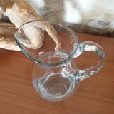 Pitcher decorating grape bunch