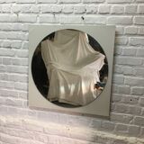 Round mirror on laminated support