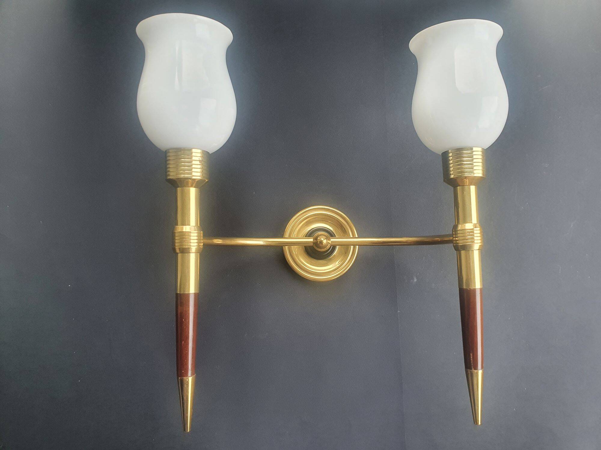 Large wall sconces torch style from the 1950s.