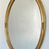 Oval mirror in carved wood