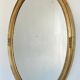 Oval mirror in carved wood