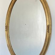 Oval mirror in carved wood