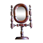 Ancient psyche turned wooden swivel table mirror