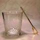 Vintage crystal ice bucket with gold tongs.