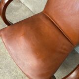Brown leather effect Skaï bridge armchair