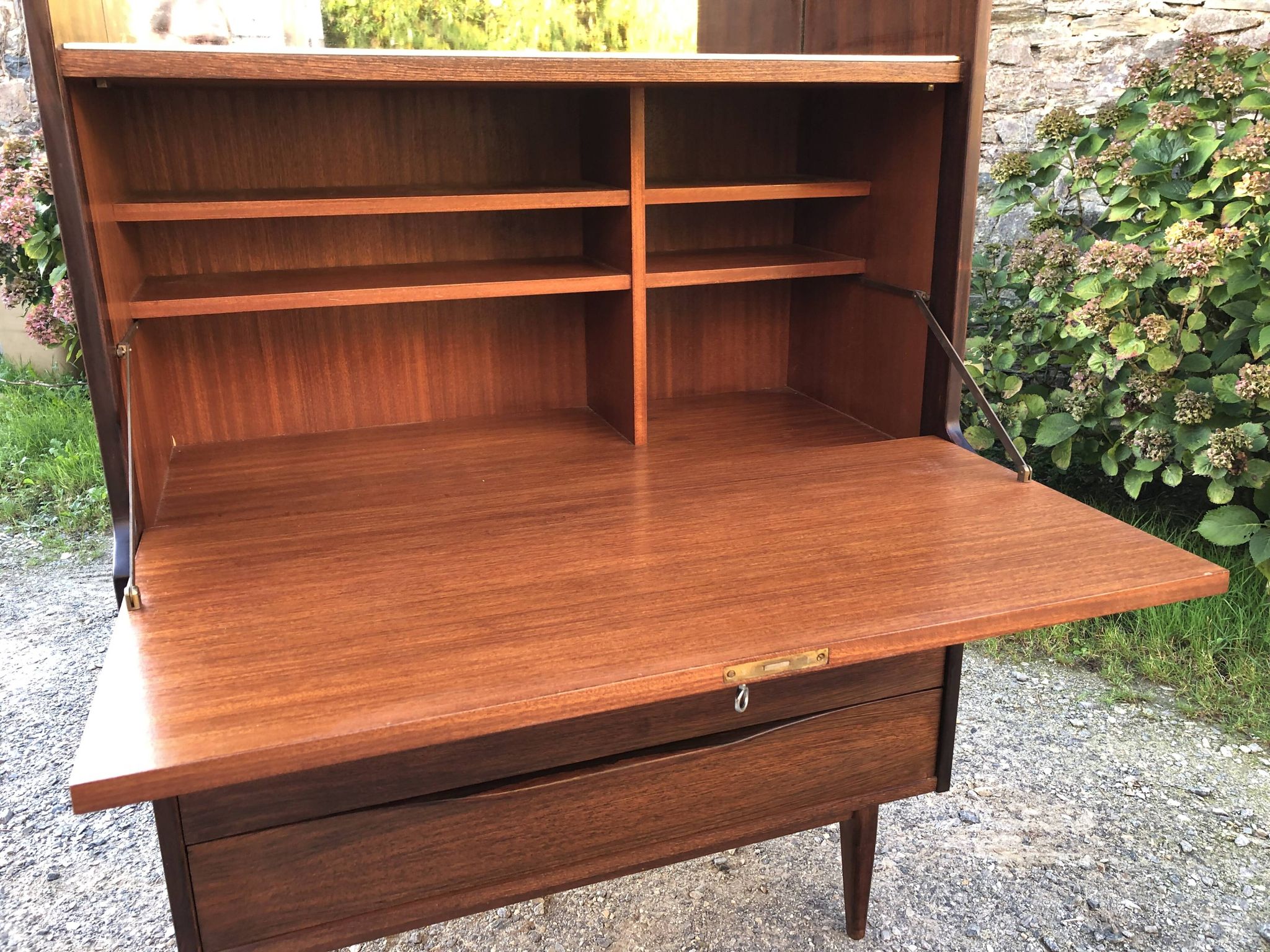 Vintage Scandinavian secretary in rosewood with drawers featuring fin-style handles.