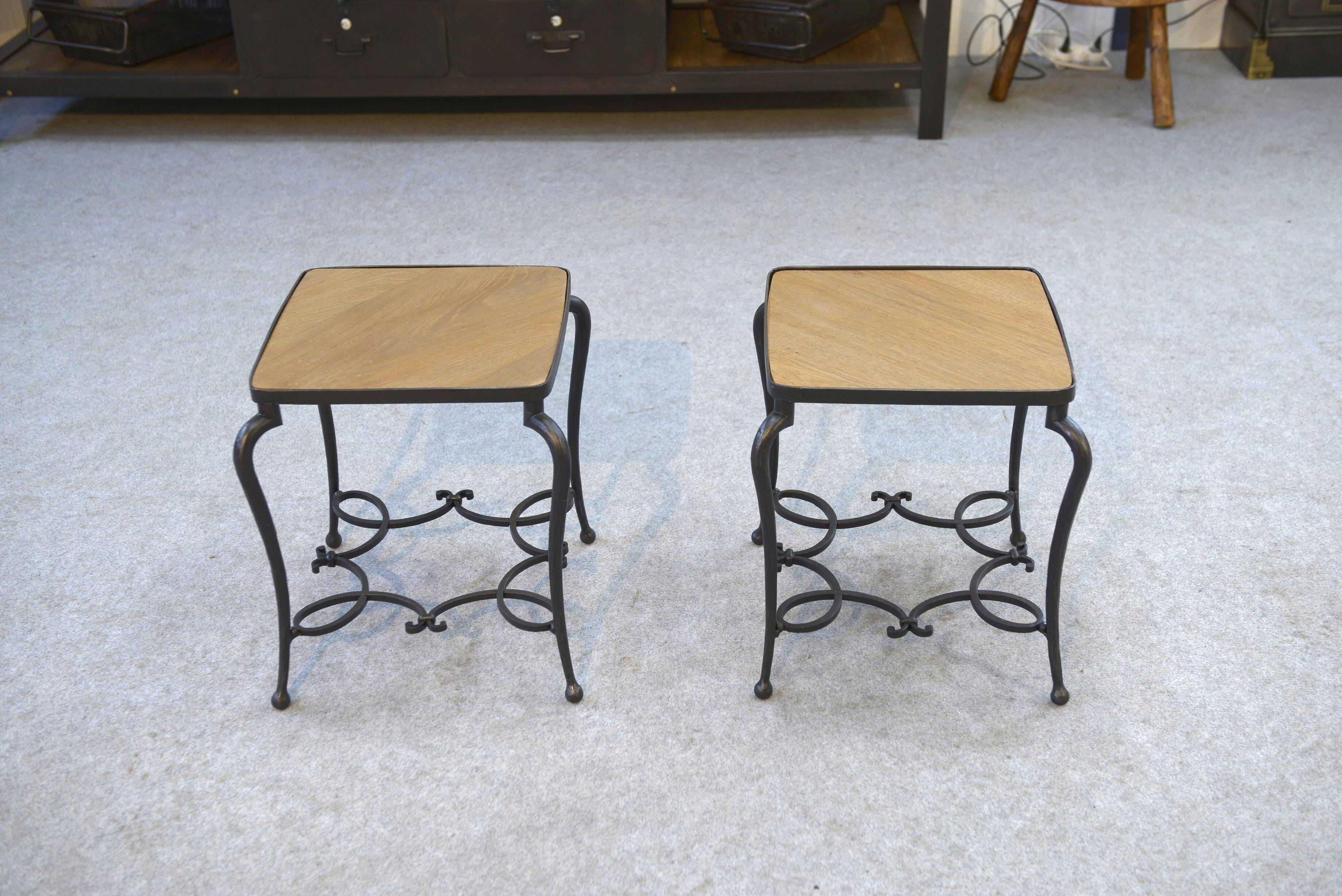 Pair of wrought iron side tables with oak tops, French work