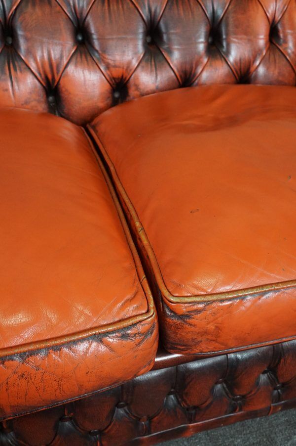 Chesterfield sofa in patinated orange leather, 2.5 seats
