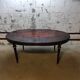 Oval Louis XVI style table with half-moon extensions.