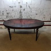 Oval Louis XVI style table with semi-circular extensions.