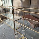 Console in gilded metal and glass