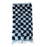Small black tile Berber rug
