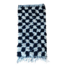 Small black tile Berber rug