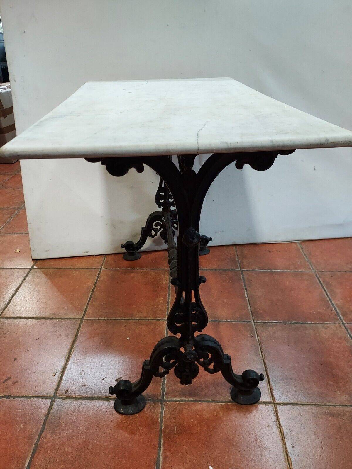 bistro table with cast iron base and marble top