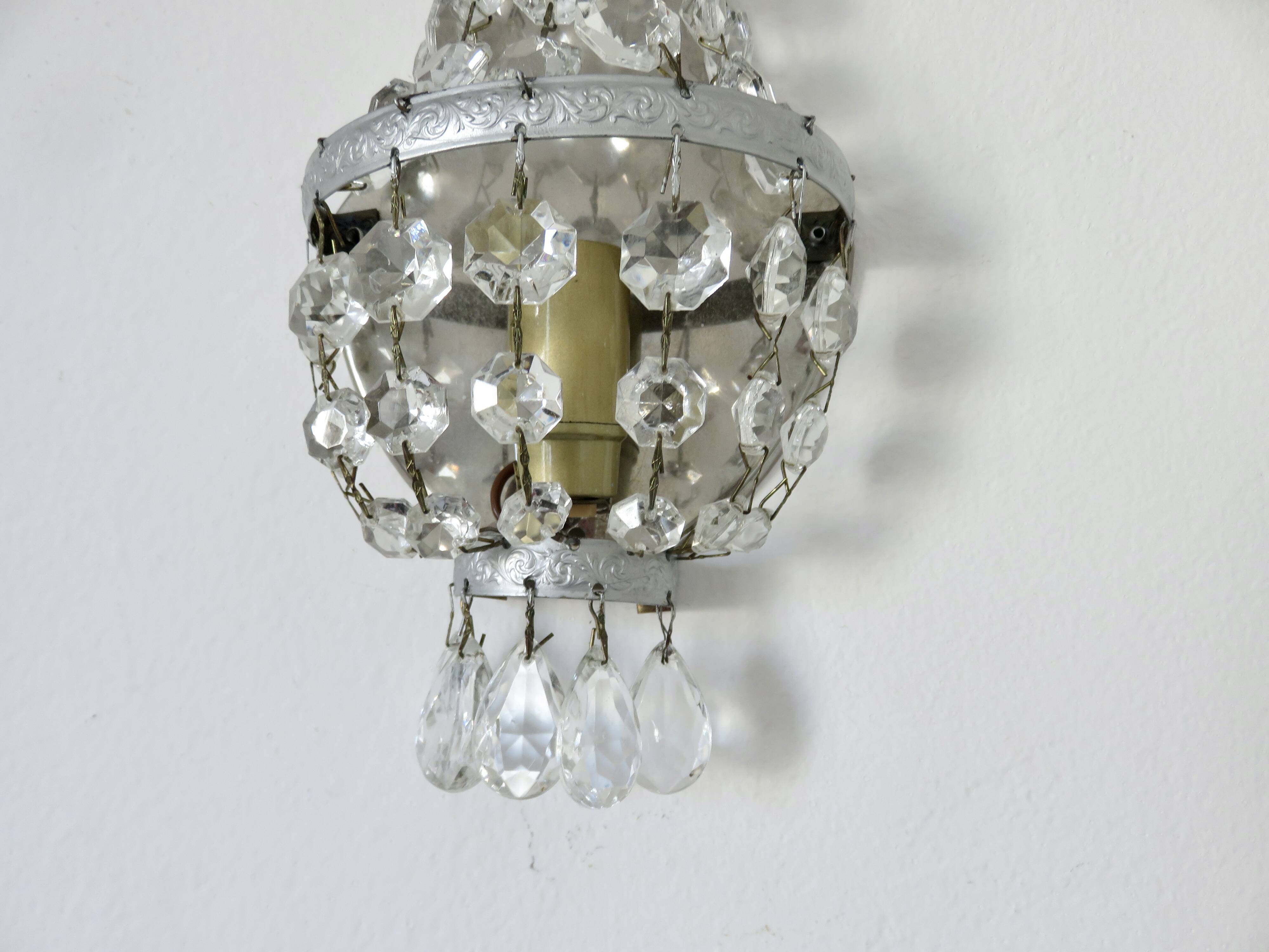Pair of silver-plated balloon wall lights with pendants, circa 1970.