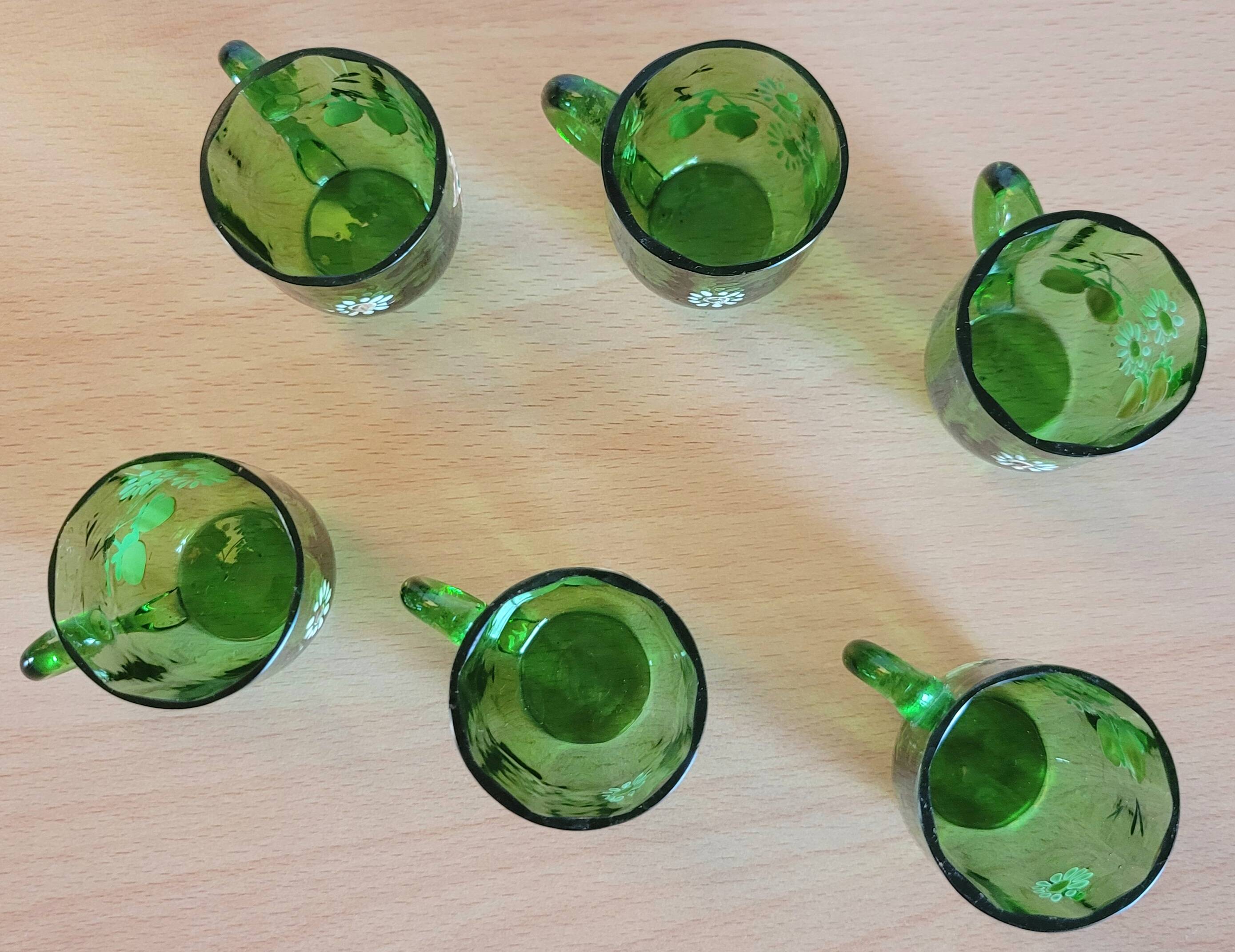 Set of 6 dark green liqueur glasses with handle and floral decoration.