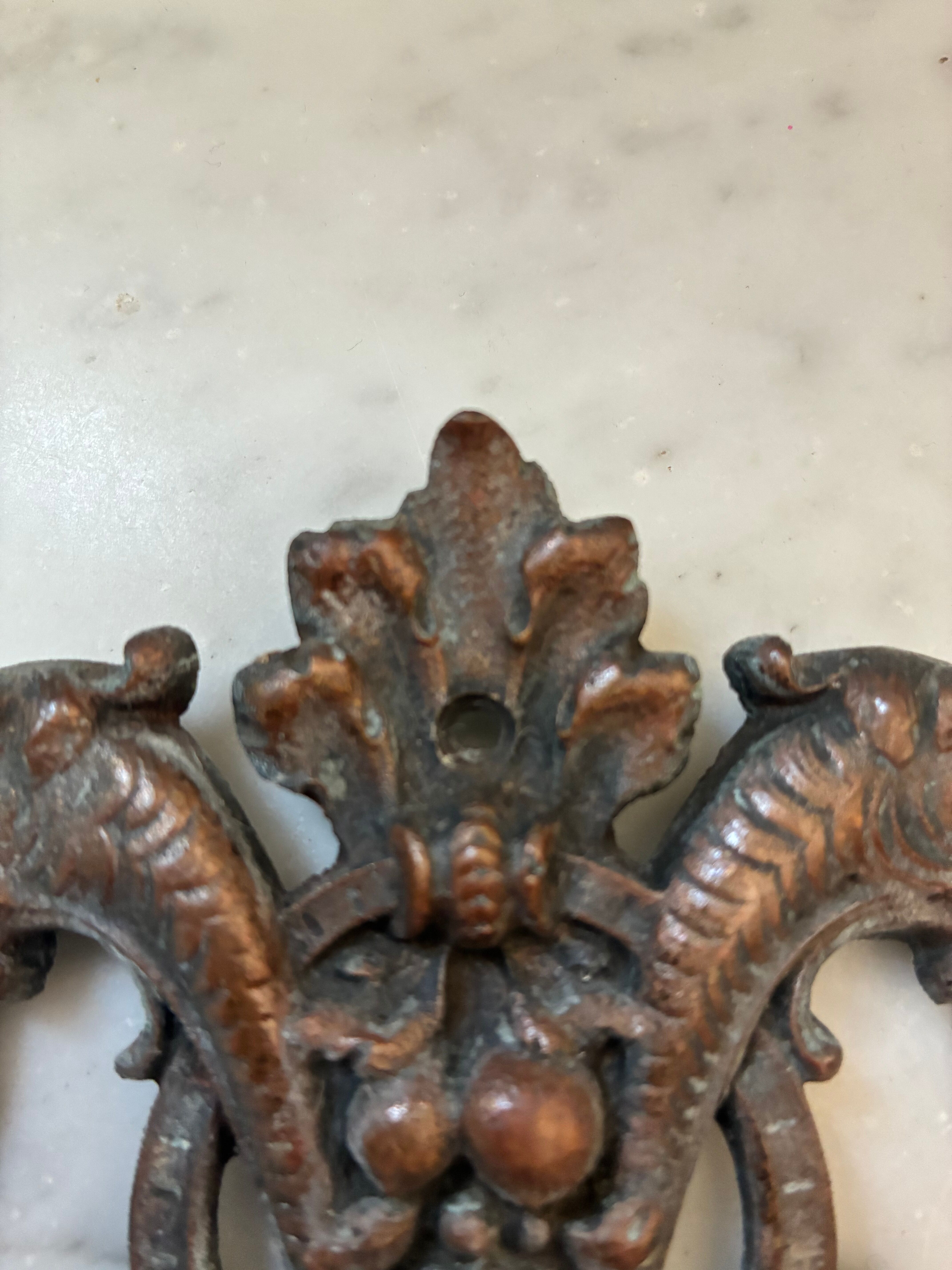 Vintage small furniture ornament in copper alloy with fish decoration.