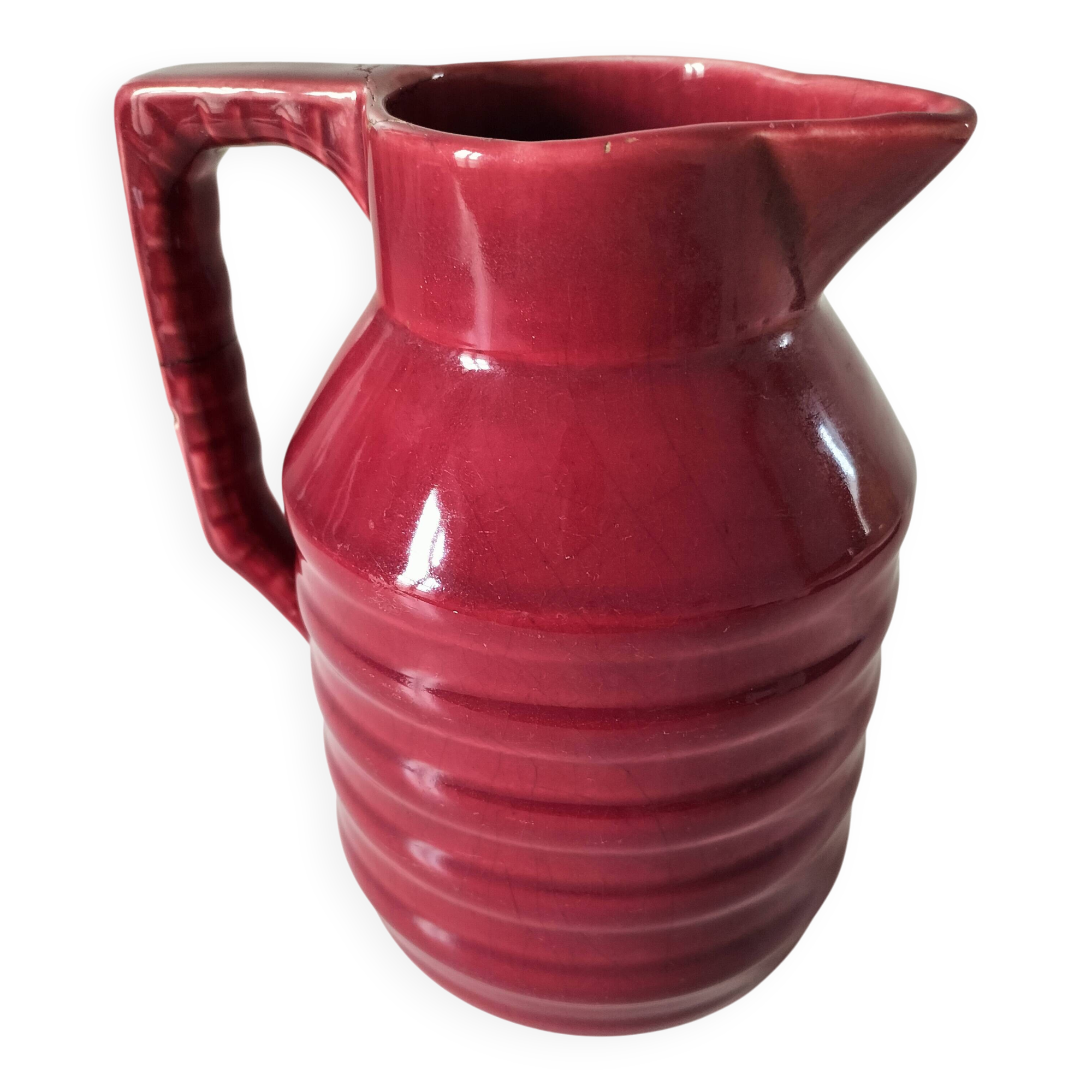 Old raspberry red pitcher from Onnaing, early 20th century.
