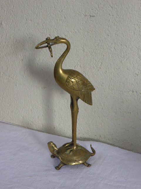 Heron in brass on the back of a turtle, press paper, vintage 1970