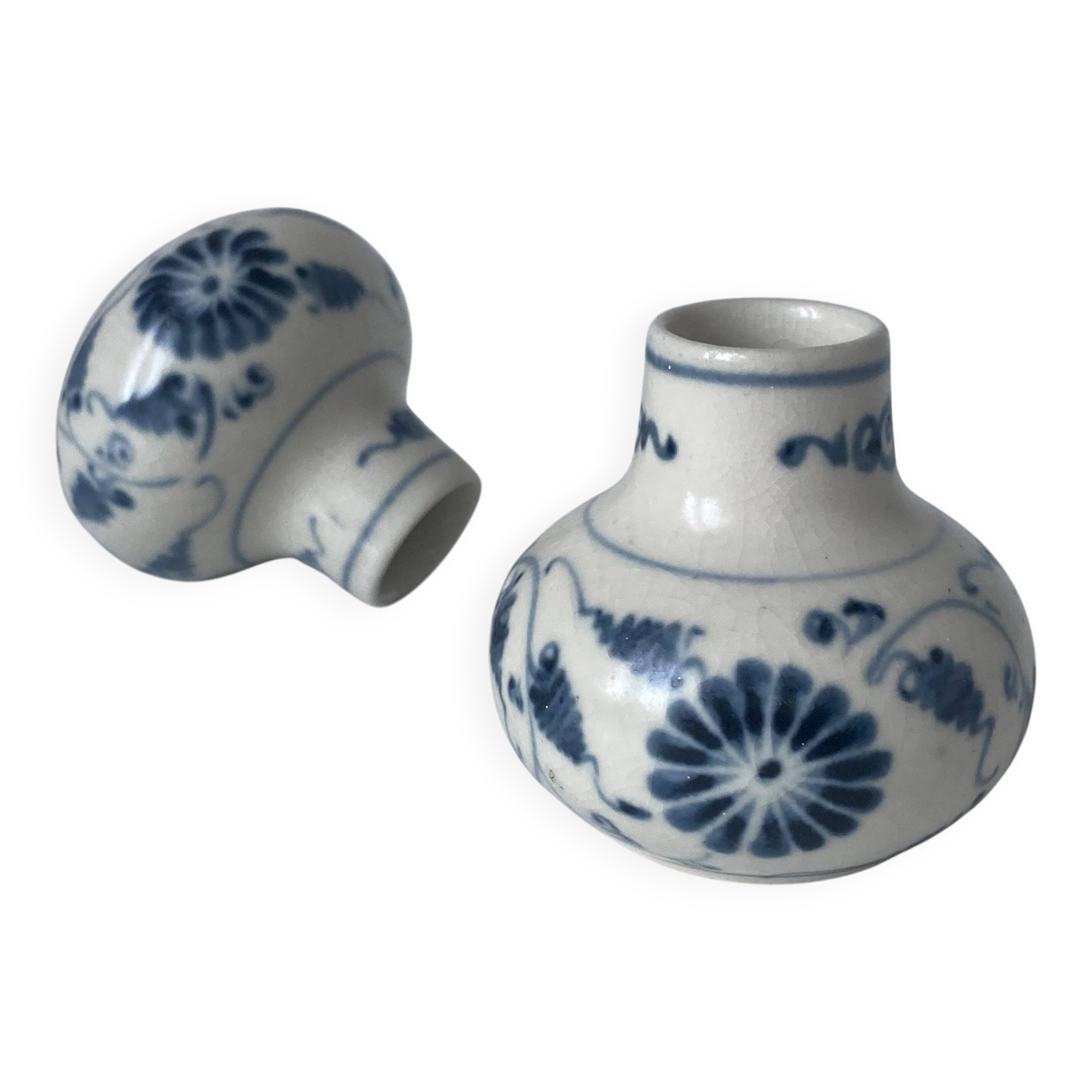 Pair of miniature blue and white Vietnamese ceramic vases with floral decoration.