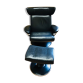 Black leather armchair stressless model jazz and its footrest