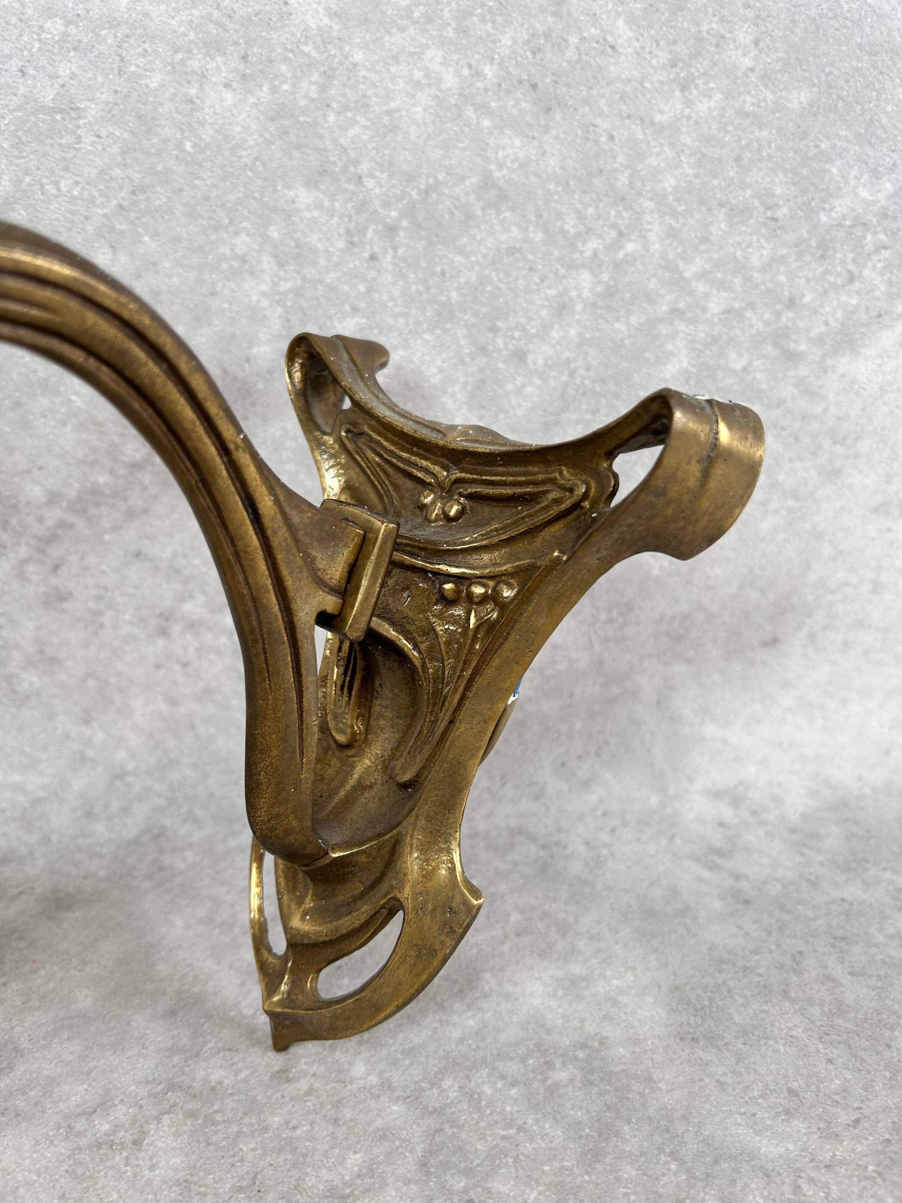 Art Nouveau wall sconces with opalescent iridescent glass