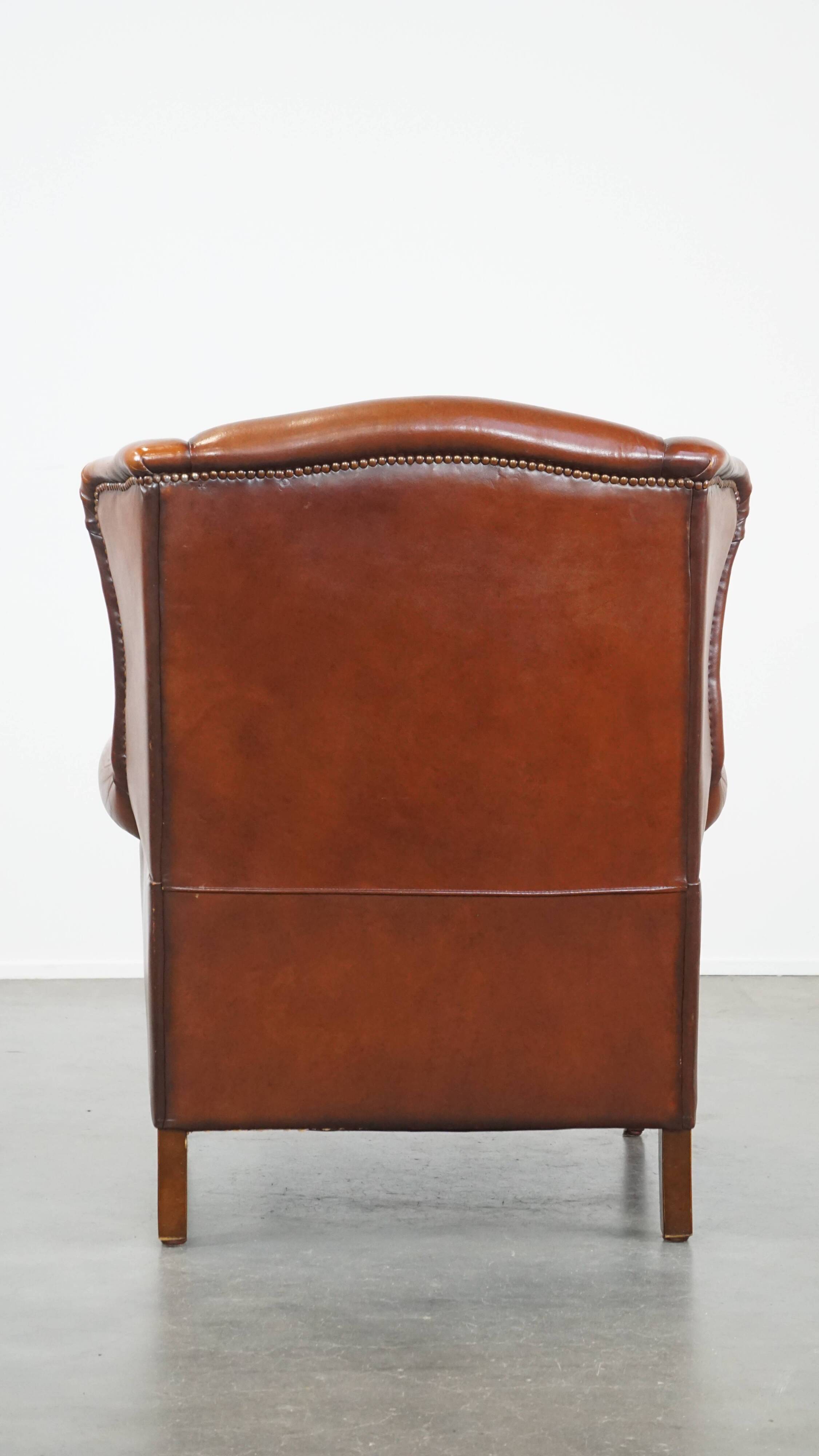 Sheepskin leather wingback chair with patina