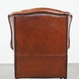 Sheepskin leather wingback chair with patina